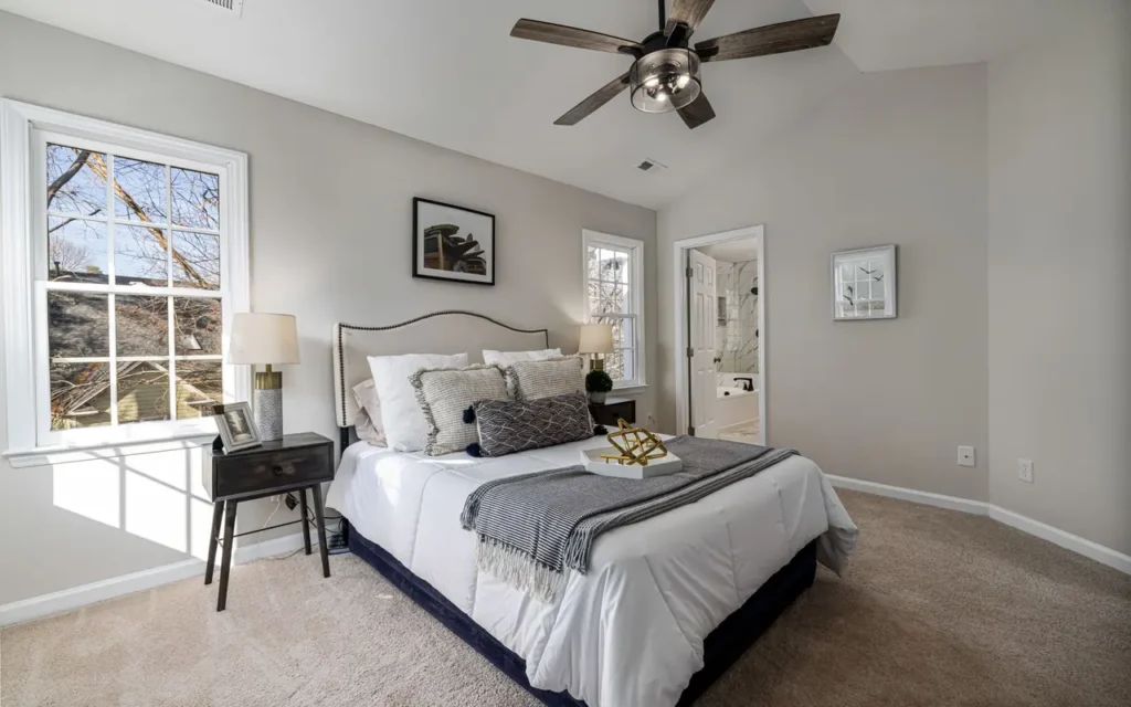 Bedroom layout with the bed, nightstand and window in view