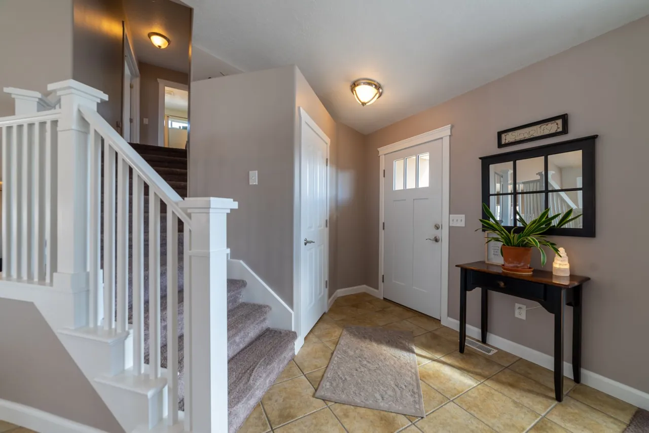 Entrance hall where the staircase rises close to the front door