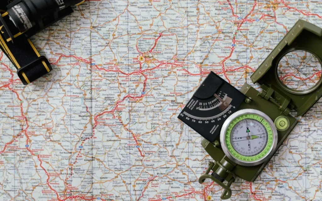 Compass resting on a paper map