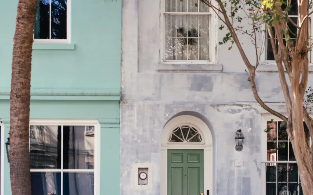 Pale mint house front with a green front door