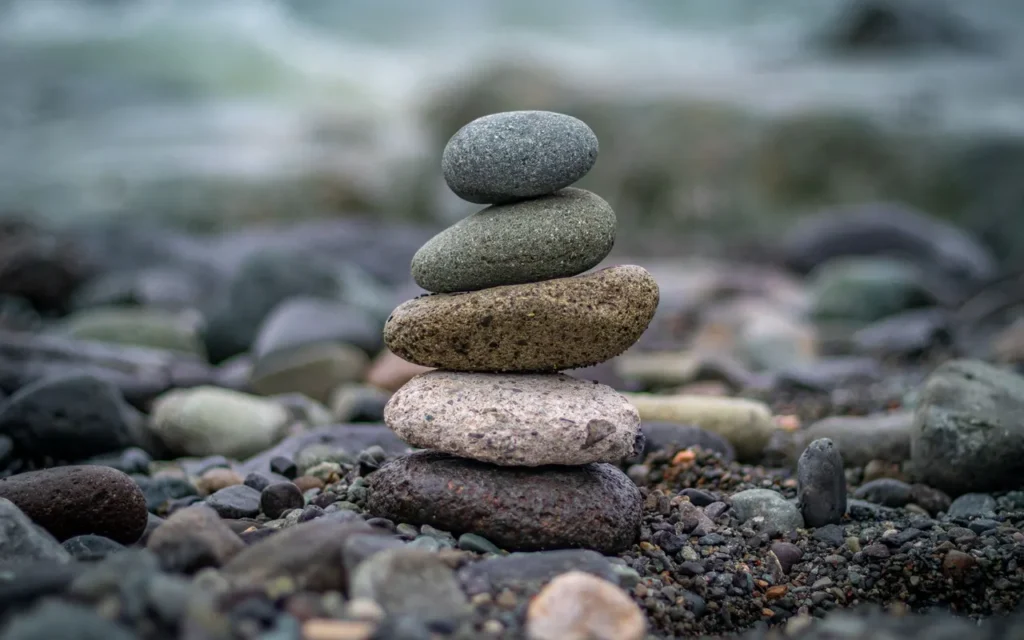 Smooth stones stacked in a balanced cairn