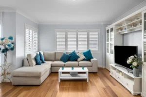 Tidy living room with a grey sofa and blue accents