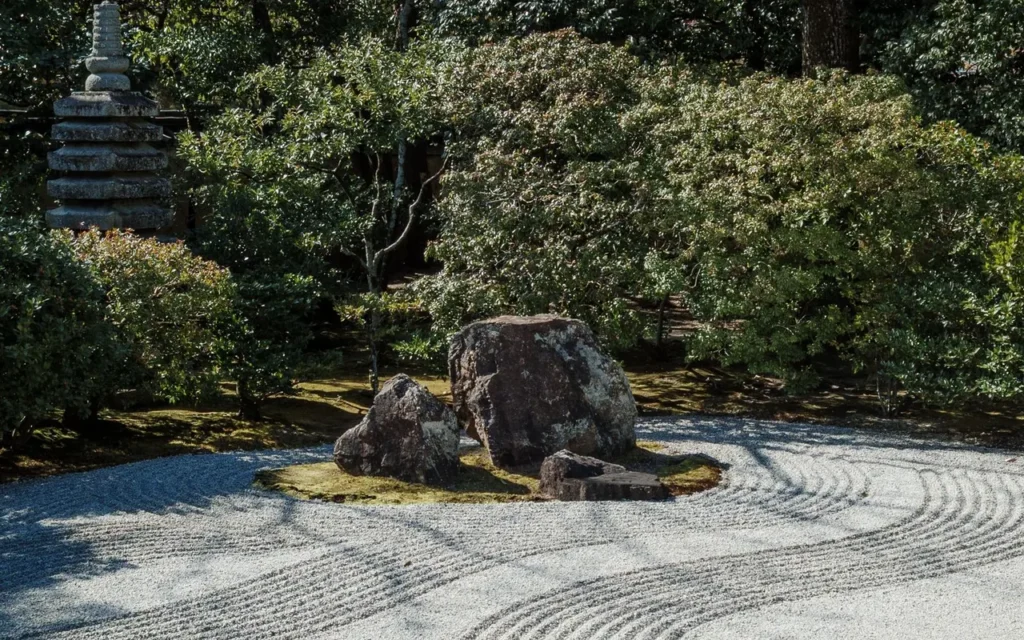 Zen garden with stone arrangements and greenery